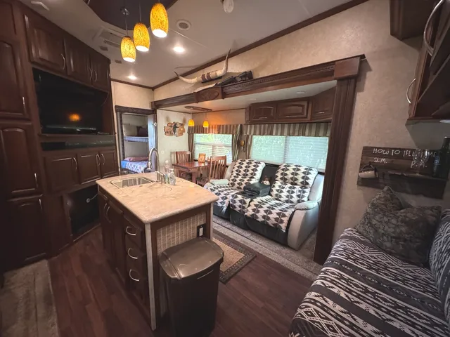 a bathroom with a sink mirror vanity and toilet