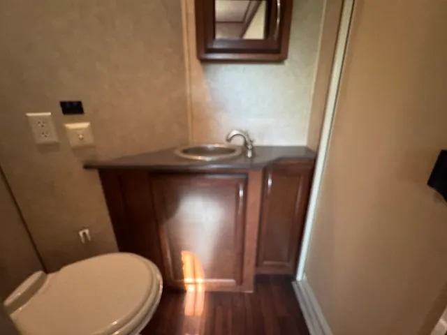 a bedroom with a large bed and a balcony view