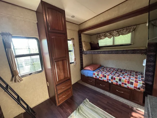 a view of a porch with furniture and a yard