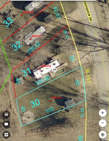 a view of a house with yard and sitting area