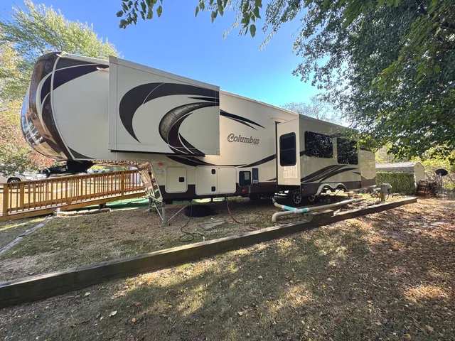 a view living room with furniture and flat screen tv