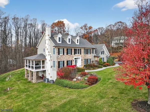 a front view of a house with a garden and plants