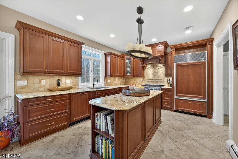 14 Jenny Layne Road Vernon, NJ 07461 - Photo 11 of 42 a kitchen with a refrigerator a sink and wooden cabinets