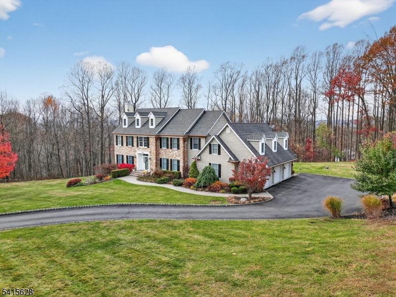 14 Jenny Layne Road Vernon, NJ 07461 - Photo 2 of 42 a front view of a house with a yard table and chairs
