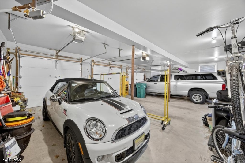 14 Jenny Layne Road Vernon, NJ 07461 - Photo 29 of 42 a car and bike parked in a garage