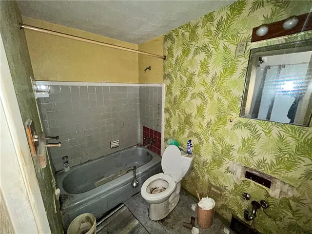 a bathroom with a sink and toilet