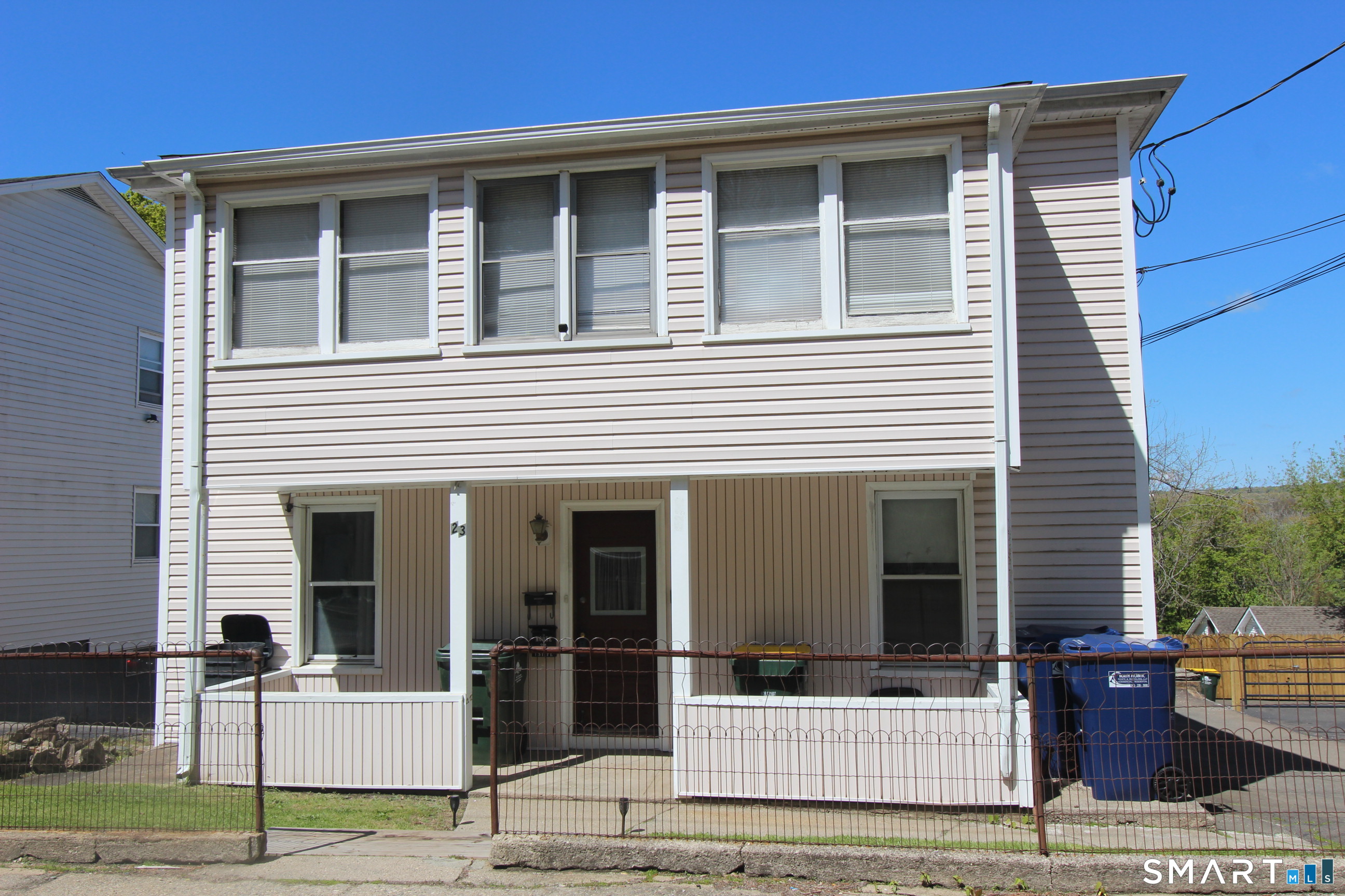 23 North Spring Street Ansonia, CT 06401 - Photo 1 of 7 a front view of a house with garden