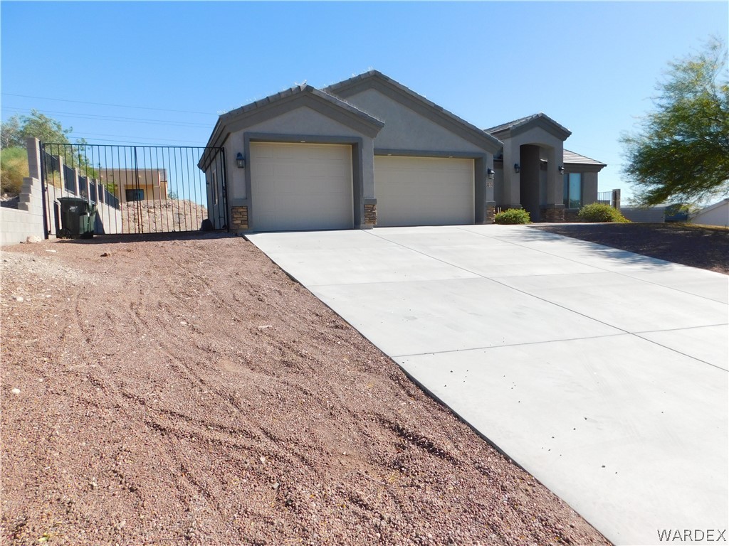 3370 South Ridge Avenue Bullhead City, AZ 86429 - Photo 3 of 56 a view of a house with a outdoor space