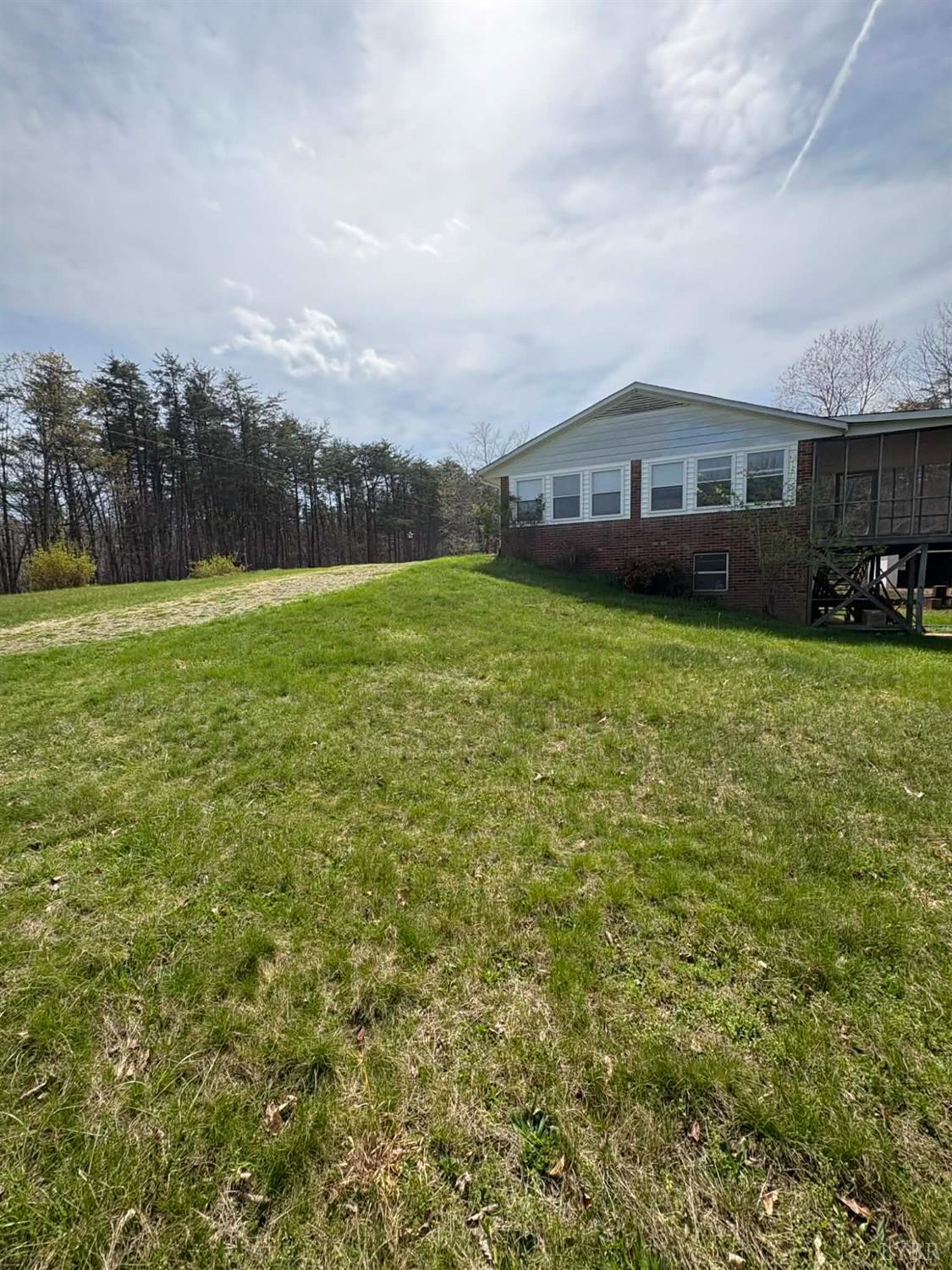 1796 Owens Mill Road Gretna, VA 24557 - Photo 11 of 24 a view of a big house with a big yard and large trees