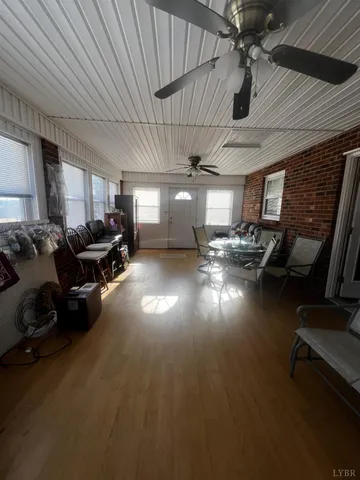 a gym room with lots of furniture and a projector