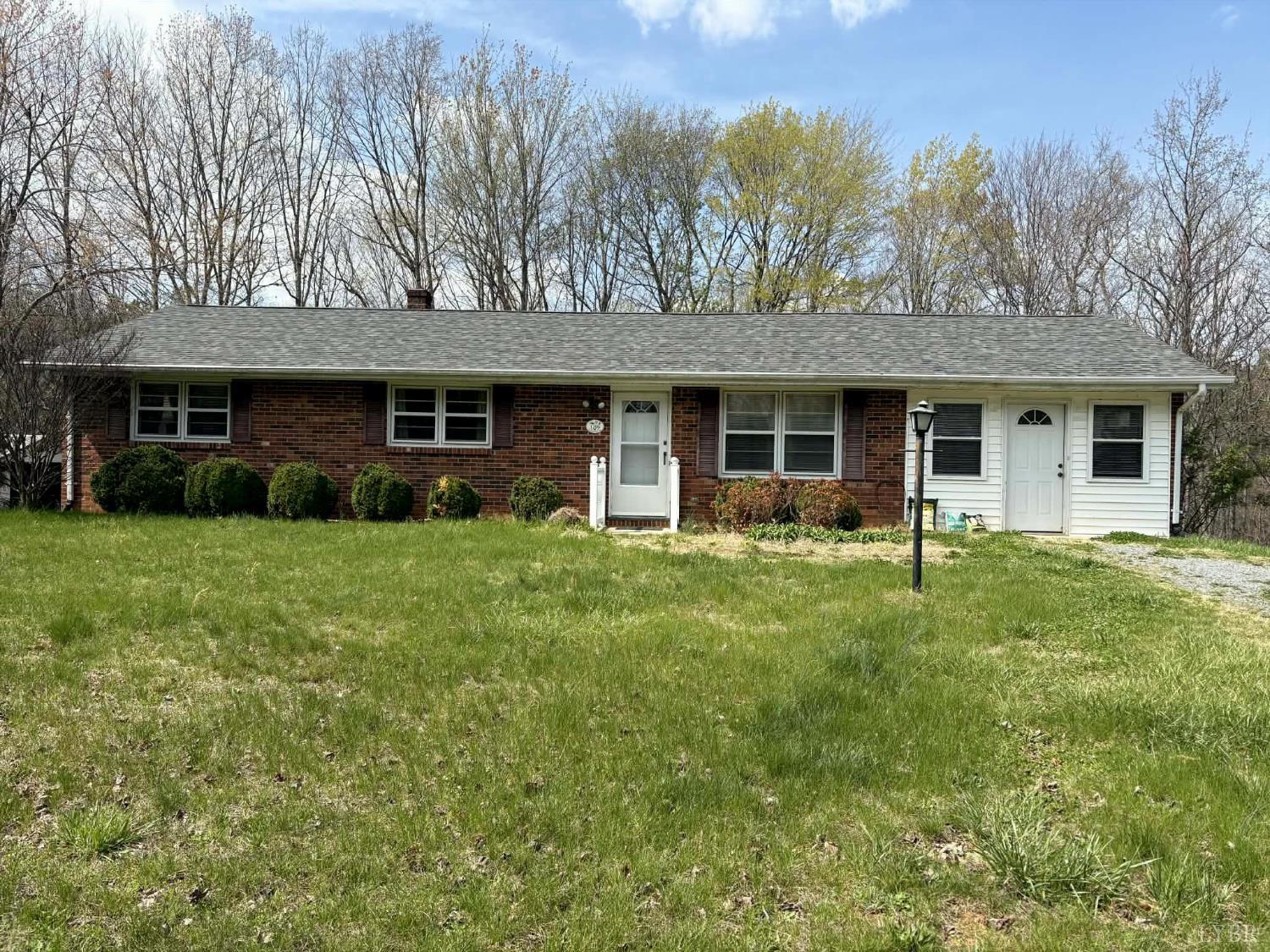 1796 Owens Mill Road Gretna, VA 24557 - Photo 2 of 24 a front view of a house with garden