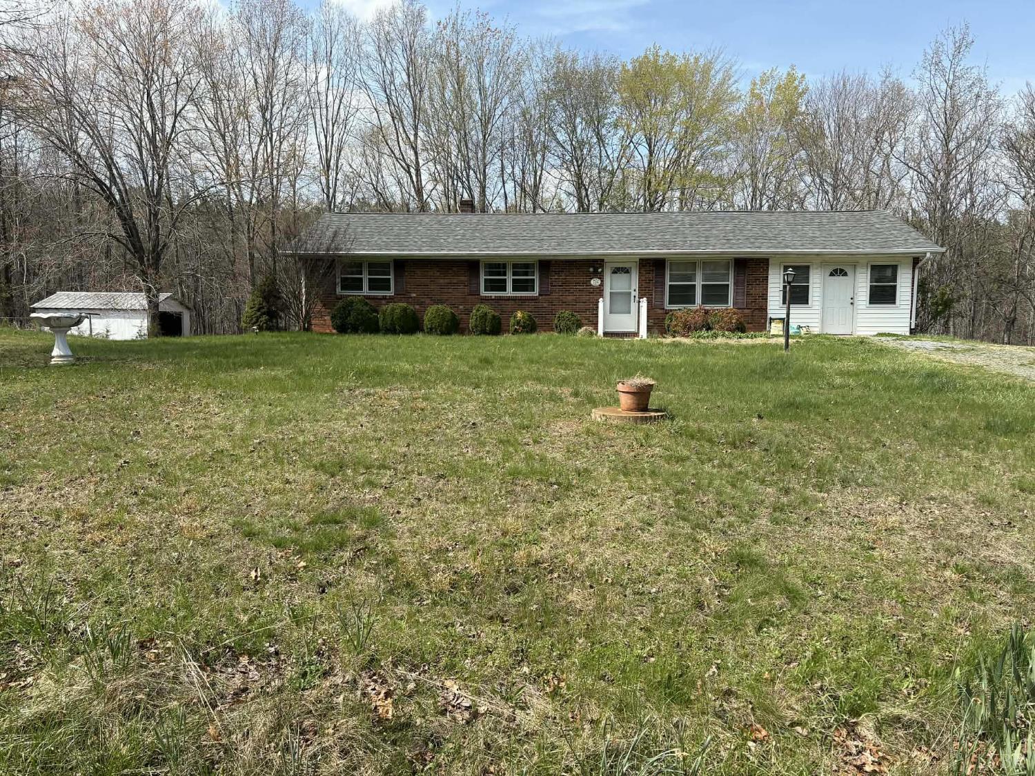 1796 Owens Mill Road Gretna, VA 24557 - Photo 3 of 24 a front view of a house with a yard