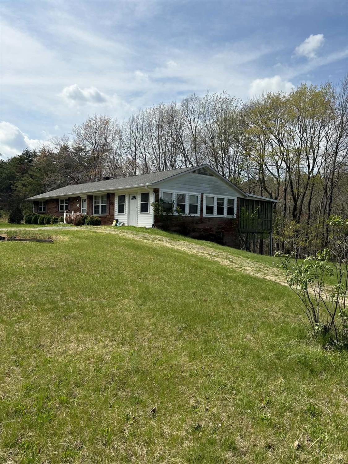 1796 Owens Mill Road Gretna, VA 24557 - Photo 4 of 24 a view of a house with a yard and sitting area