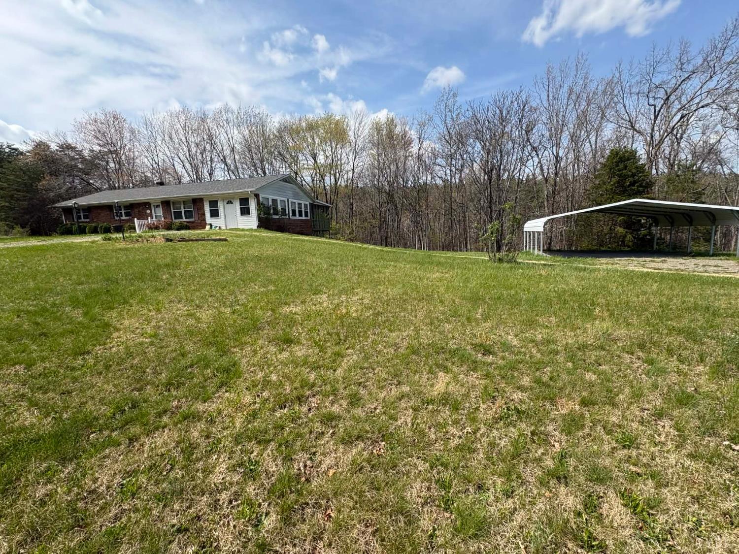 1796 Owens Mill Road Gretna, VA 24557 - Photo 5 of 24 a front view of a house with garden