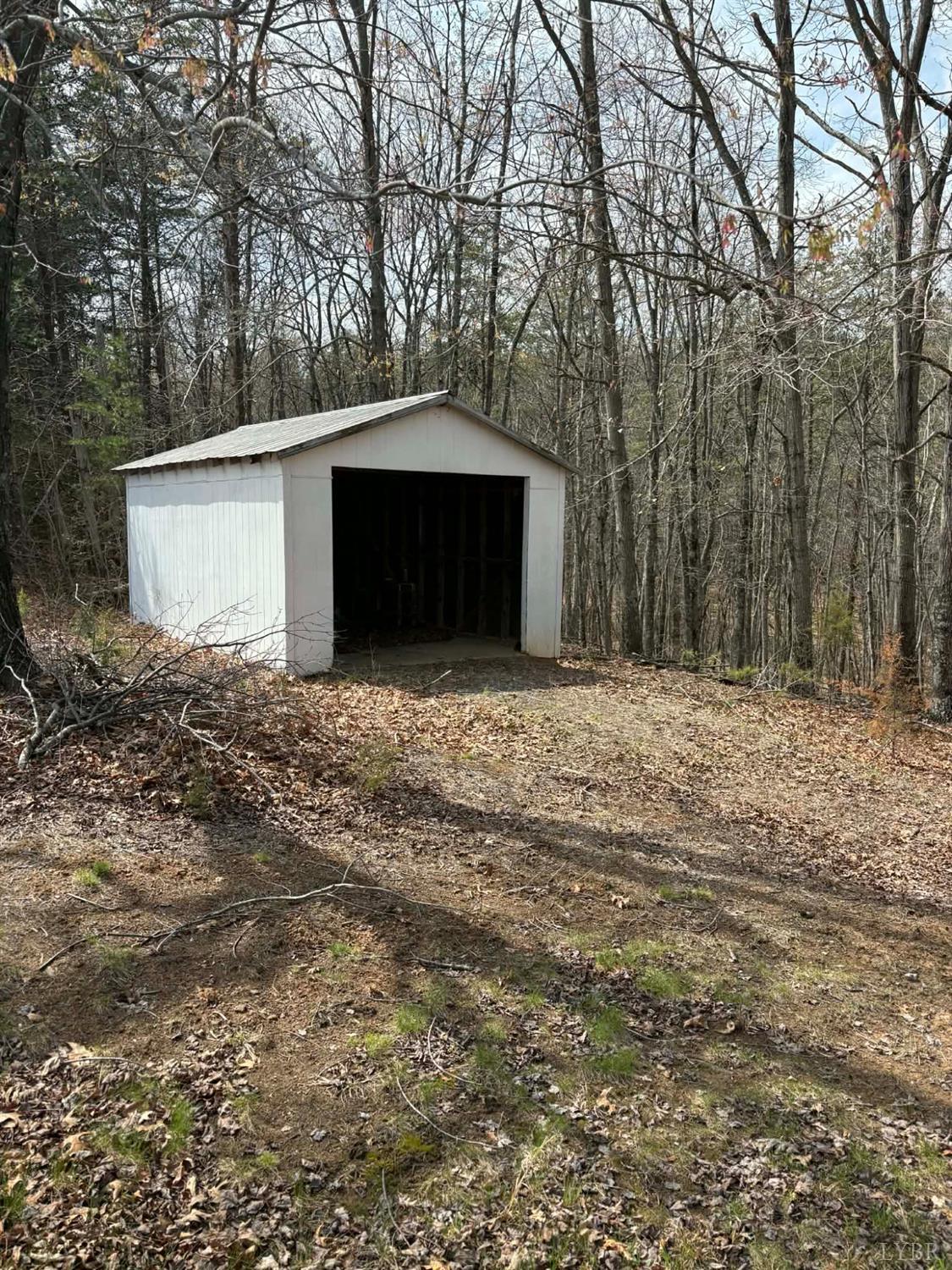 1796 Owens Mill Road Gretna, VA 24557 - Photo 8 of 24 a big room with trees in front of it
