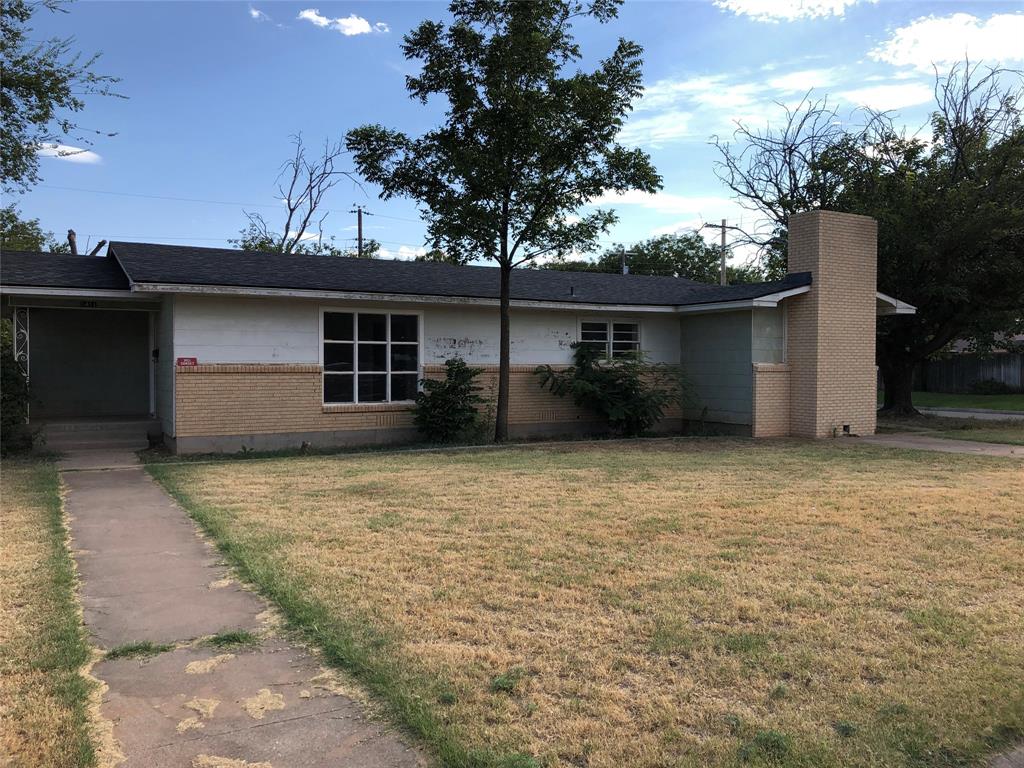 a front view of house with an outdoor space