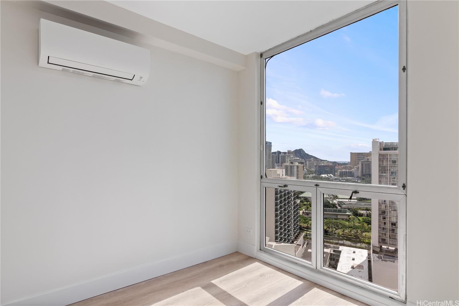 469 Ena Road, Unit 2304 Honolulu, HI 96815 - Photo 12 of 25 Primary bedroom featuring a quiet and efficient split AC system for year-round comfort