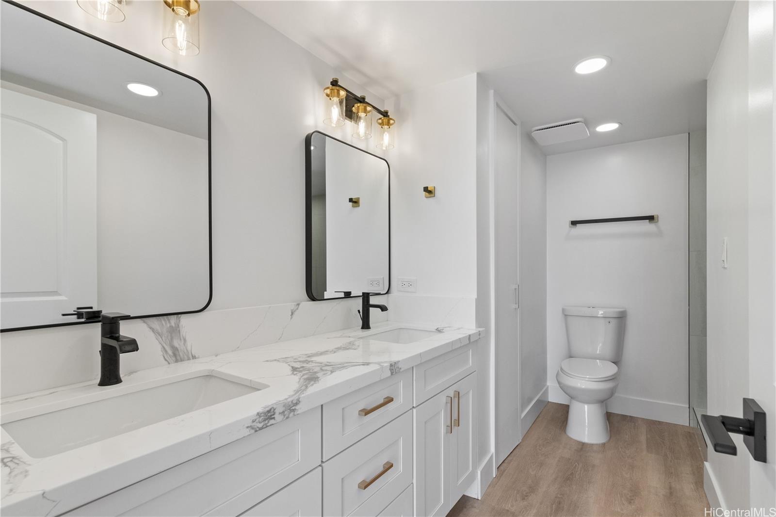 469 Ena Road, Unit 2304 Honolulu, HI 96815 - Photo 13 of 25 Primary bath featuring dual vanities and beautiful modern fixtures