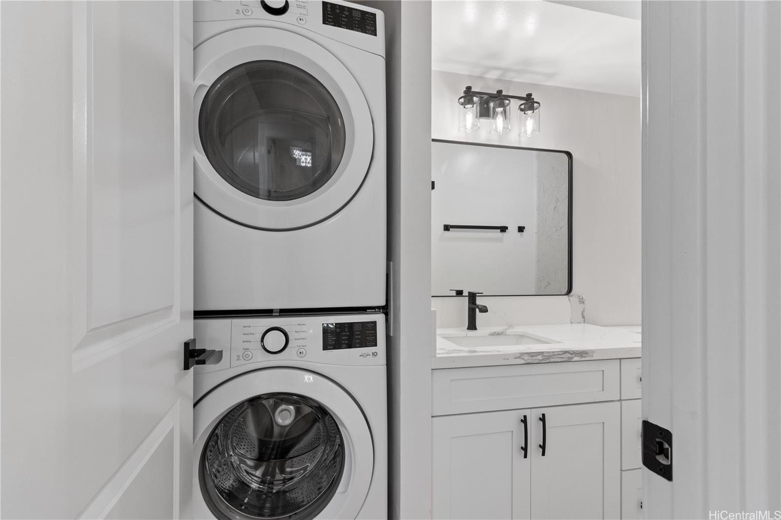 469 Ena Road, Unit 2304 Honolulu, HI 96815 - Photo 17 of 25 Brand-new washer and dryer complemented by an updated water inlet box