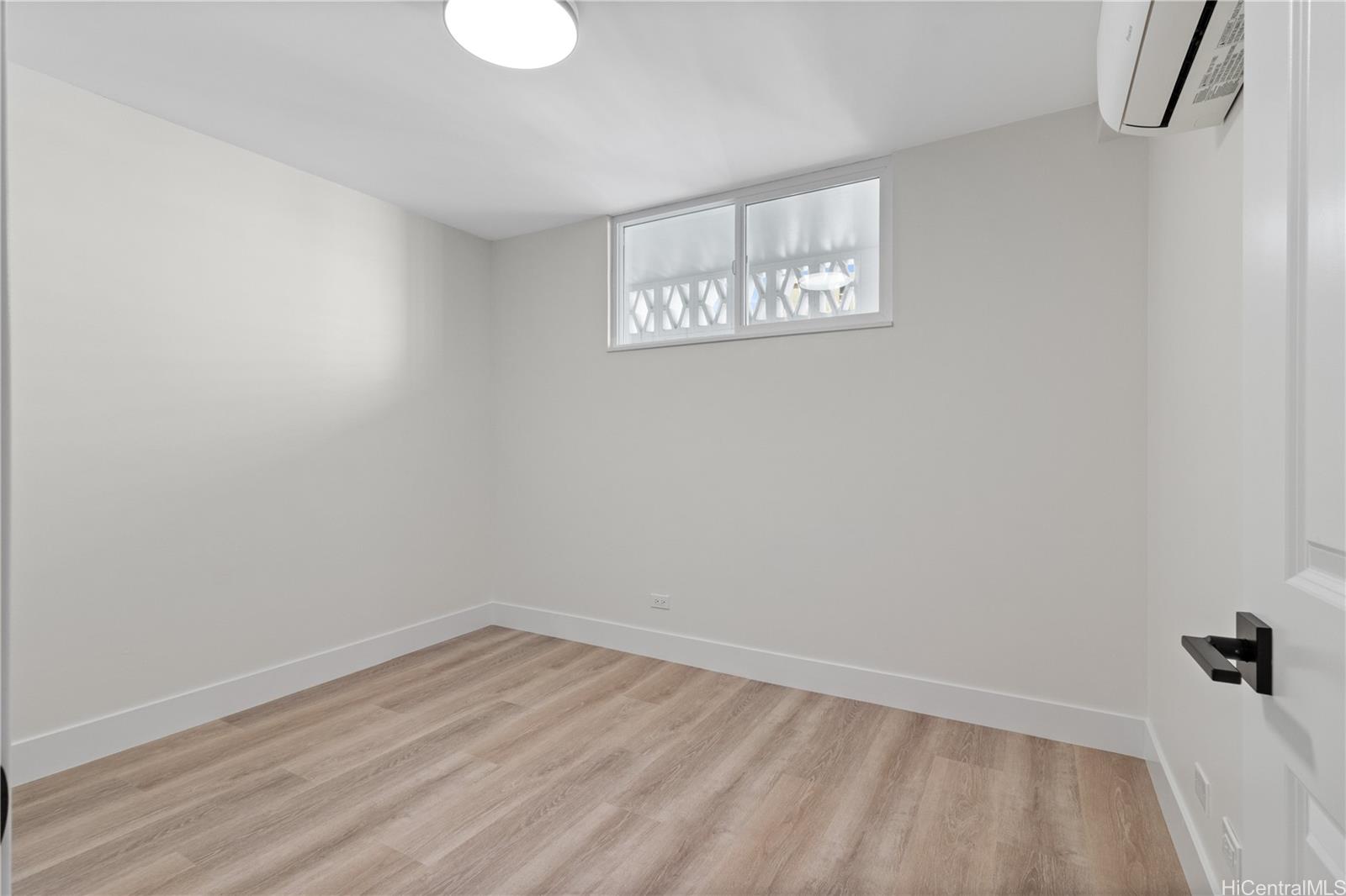 469 Ena Road, Unit 2304 Honolulu, HI 96815 - Photo 19 of 25 Spacious family bedroom with a custom closet, generous storage, and a split AC system for year-round comfort