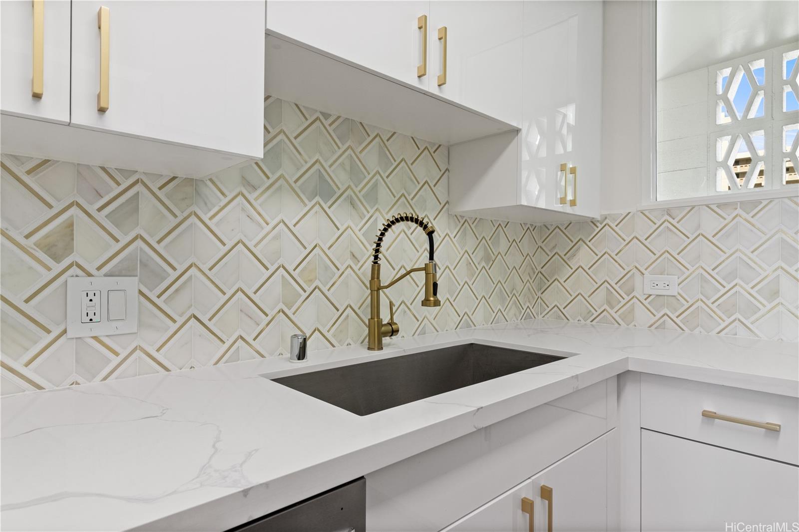 469 Ena Road, Unit 2304 Honolulu, HI 96815 - Photo 8 of 25 Beautifully detailed backsplash adds elegance and character to this modern kitchen