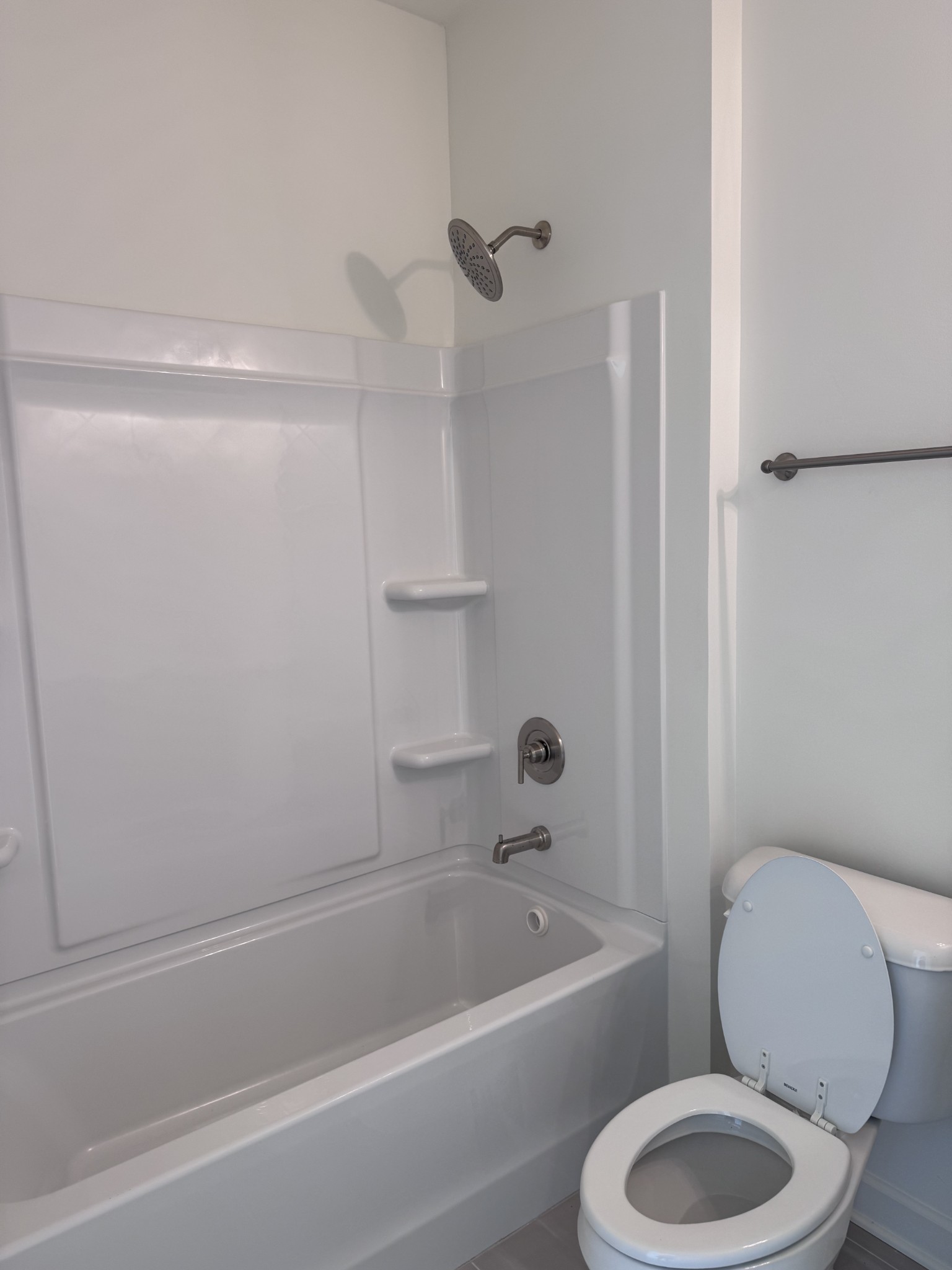 1963 Amacher Drive Spring Hill, TN 37174 - Photo 14 of 17 a white toilet and tub sitting next to a bathroom sink