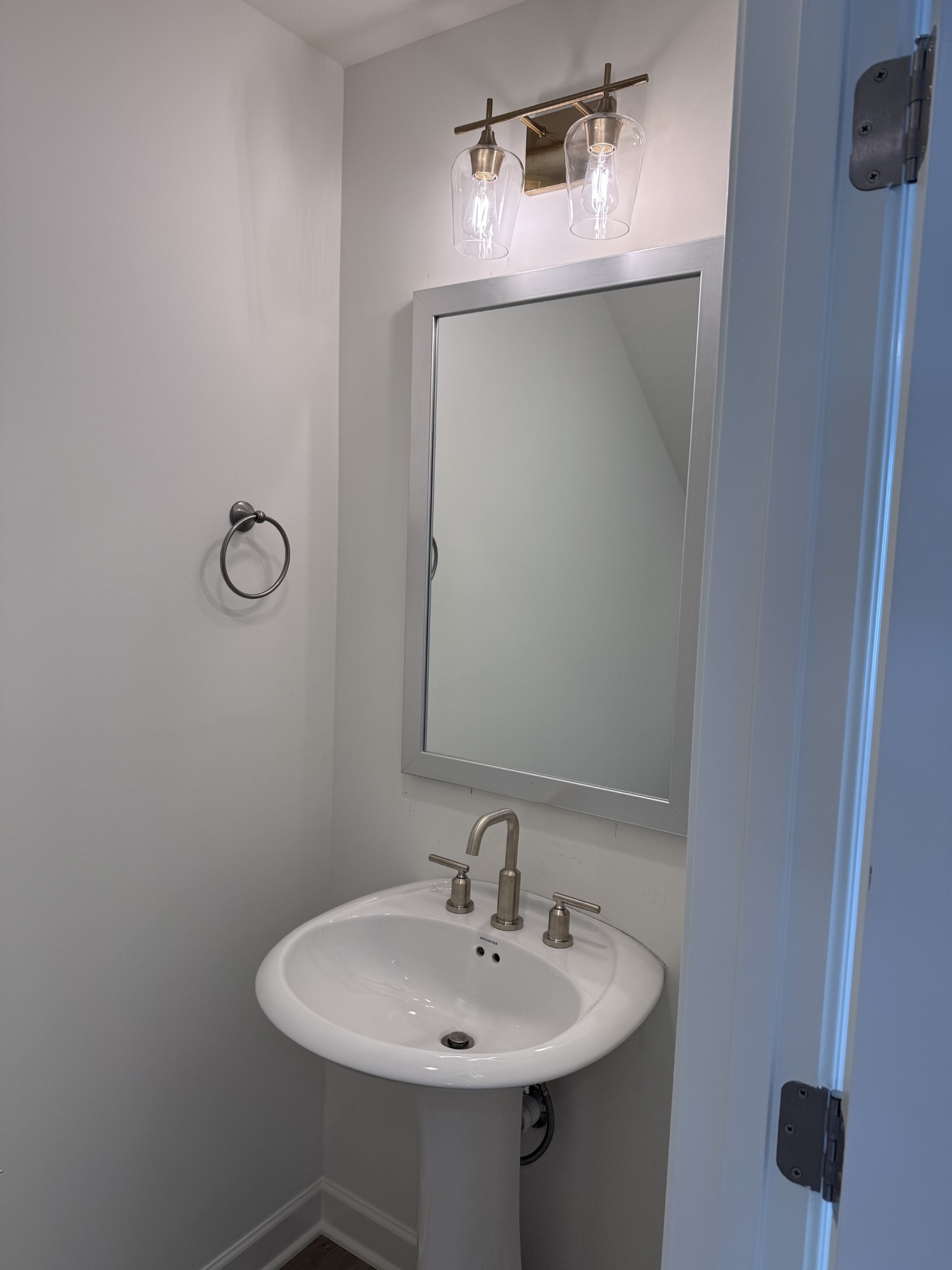 1963 Amacher Drive Spring Hill, TN 37174 - Photo 3 of 17 a bathroom with a sink and mirror