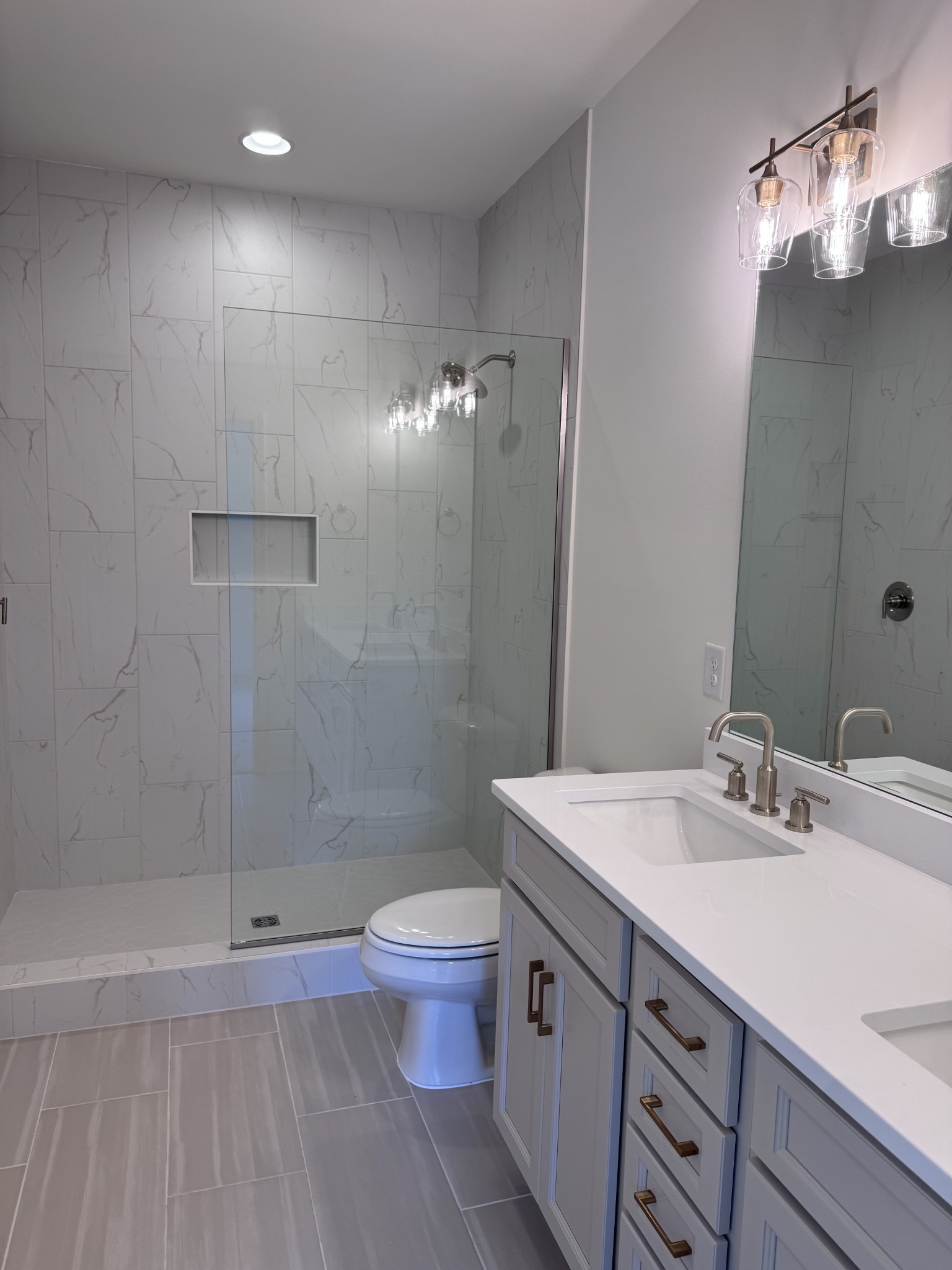 1963 Amacher Drive Spring Hill, TN 37174 - Photo 9 of 17 a bathroom with a sink a toilet and shower