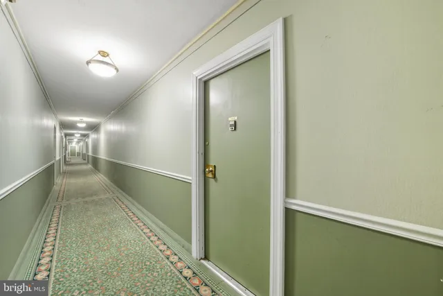 a view of a brick house with large windows