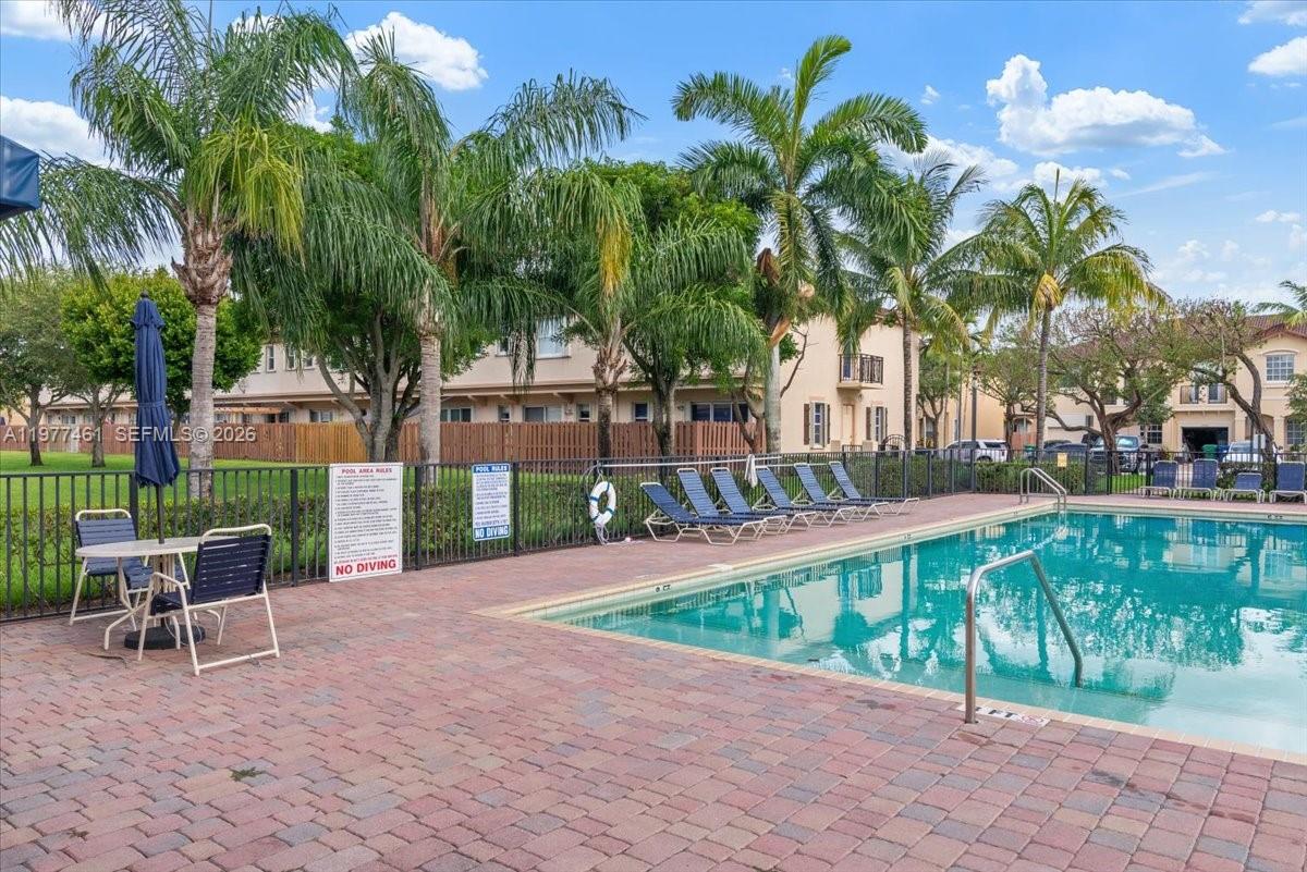 12958 Southwest 135th Street Miami, FL 33186 - Photo 14 of 14 a view of a yard with a patio