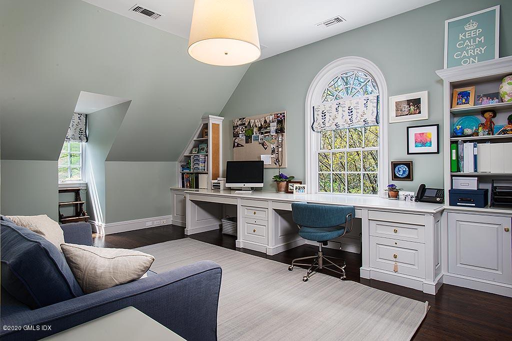 27 Midwood Road Greenwich, CT 06830 - Photo 17 of 30 a view of a livingroom with workspace and a window