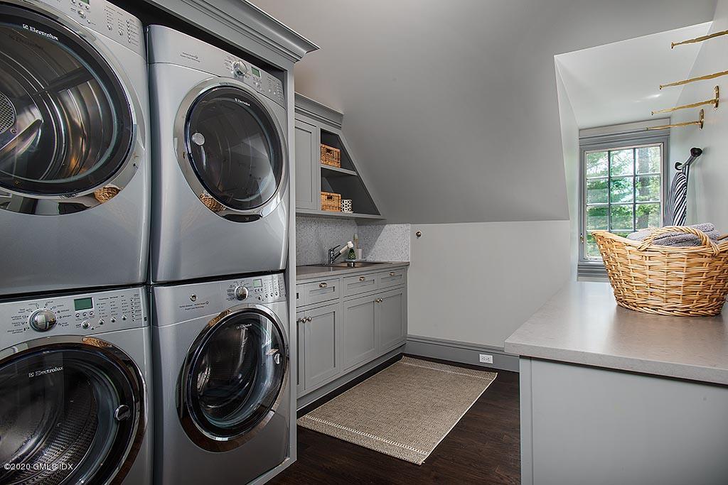 27 Midwood Road Greenwich, CT 06830 - Photo 18 of 30 a view of a storage and utility room with washer and dryer