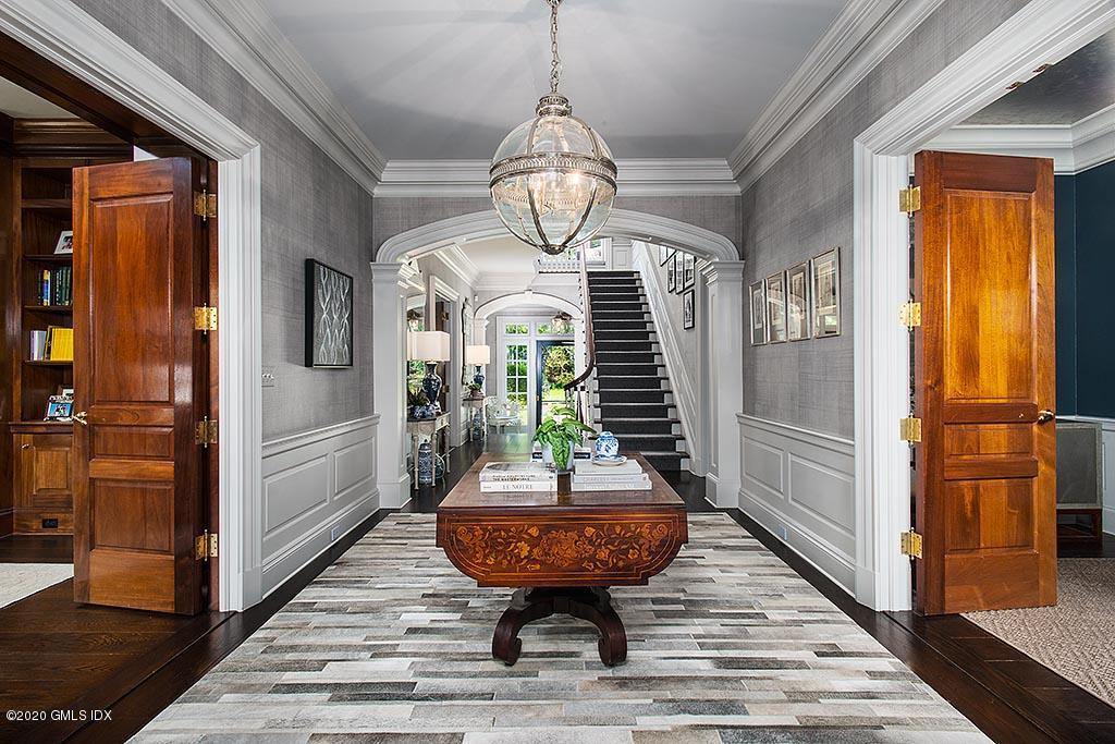 27 Midwood Road Greenwich, CT 06830 - Photo 2 of 30 a view of a hallway with wooden floor and windows