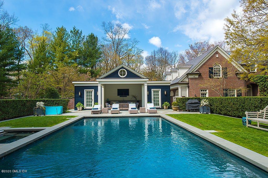 27 Midwood Road Greenwich, CT 06830 - Photo 23 of 30 a front view of a house with swimming pool having outdoor seating