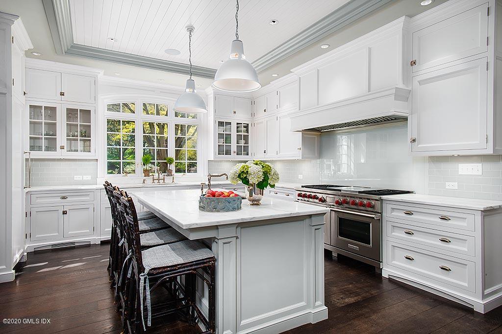 27 Midwood Road Greenwich, CT 06830 - Photo 9 of 30 a kitchen with a stove a sink and cabinets