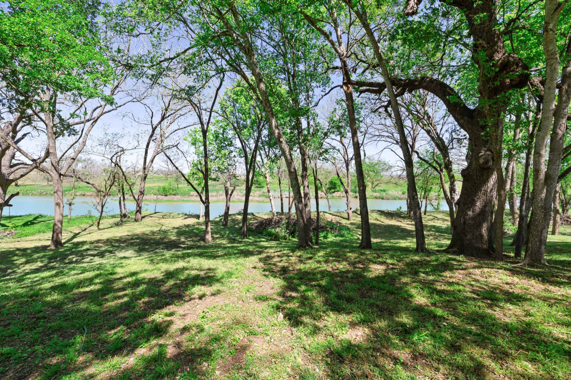 571 Ranch Road 1 Stonewall, TX 78671 - Photo 17 of 21 View of grassy yard with a water view