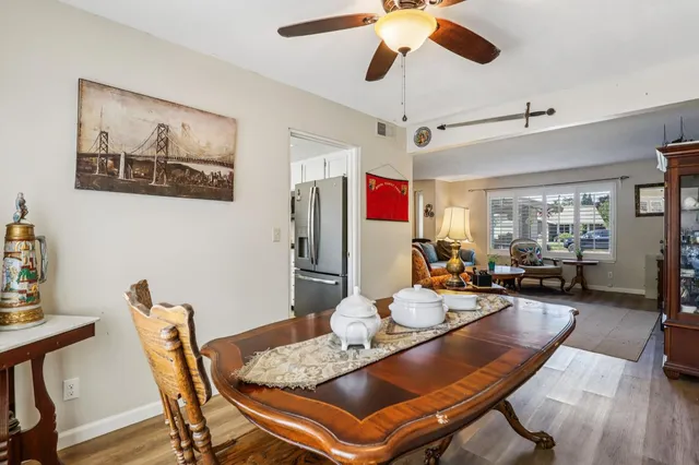 a workspace with wooden floor and windows