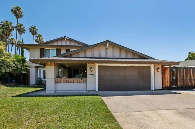 a front view of a house with garage