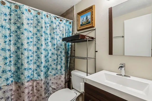 a bedroom with bed and a window