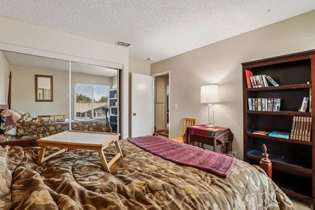 a bathroom with a toilet a sink and a mirror