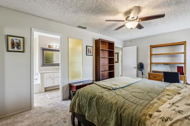 a bathroom with a bathtub a sink and a mirror