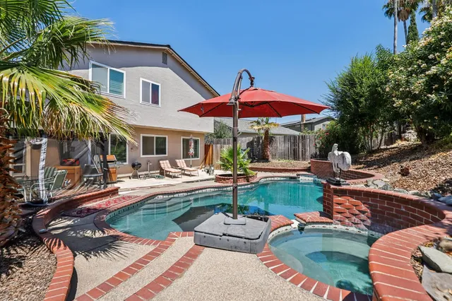 a view of swimming pool with outdoor seating