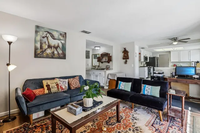 a living room with furniture and a rug
