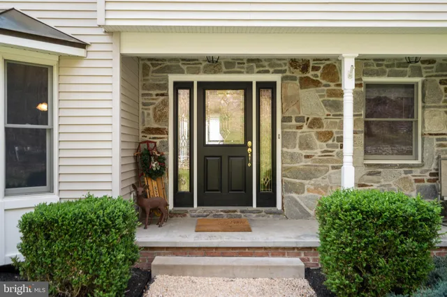 a view of a dining room with furniture wooden floor and chandelier