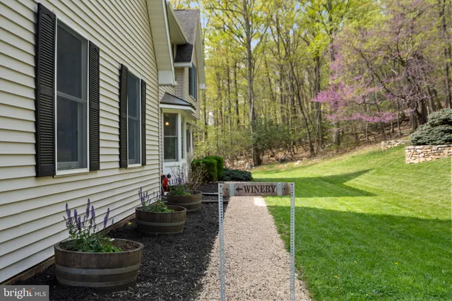 a view of a hallway with wooden floor and entryway