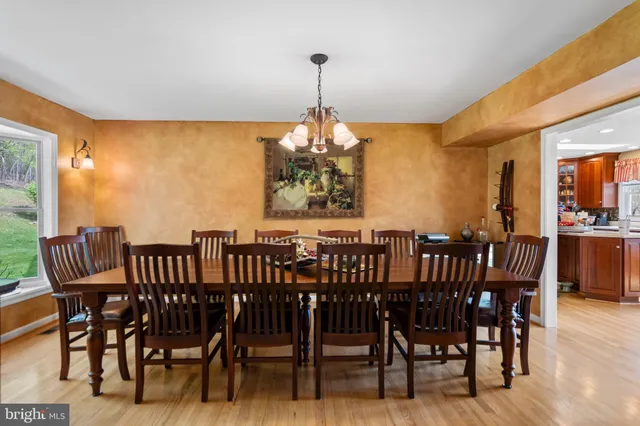 a view of a dining room with furniture window and outside view
