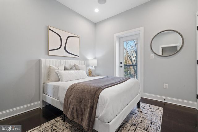 a bedroom with a bed and cabinets