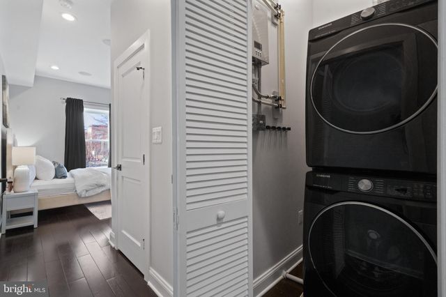 a bedroom with a bed and a fireplace