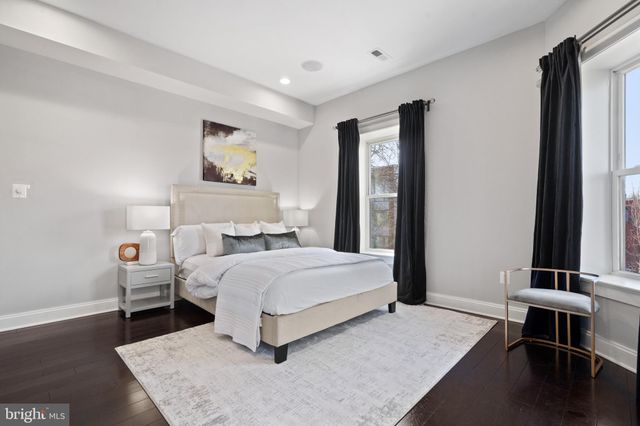 a bedroom with a bed and a fireplace