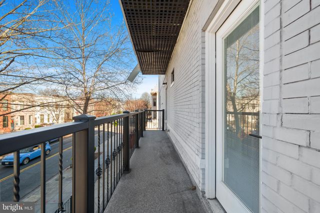 a front view of a building with street view